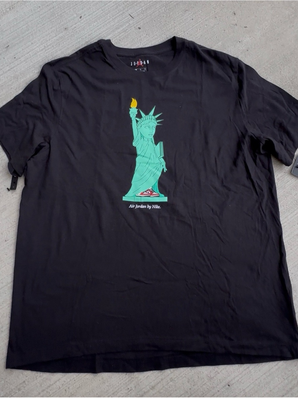 Air Jordan x Nike Black Tee with Mint-Green Statue of Liberty Graphic